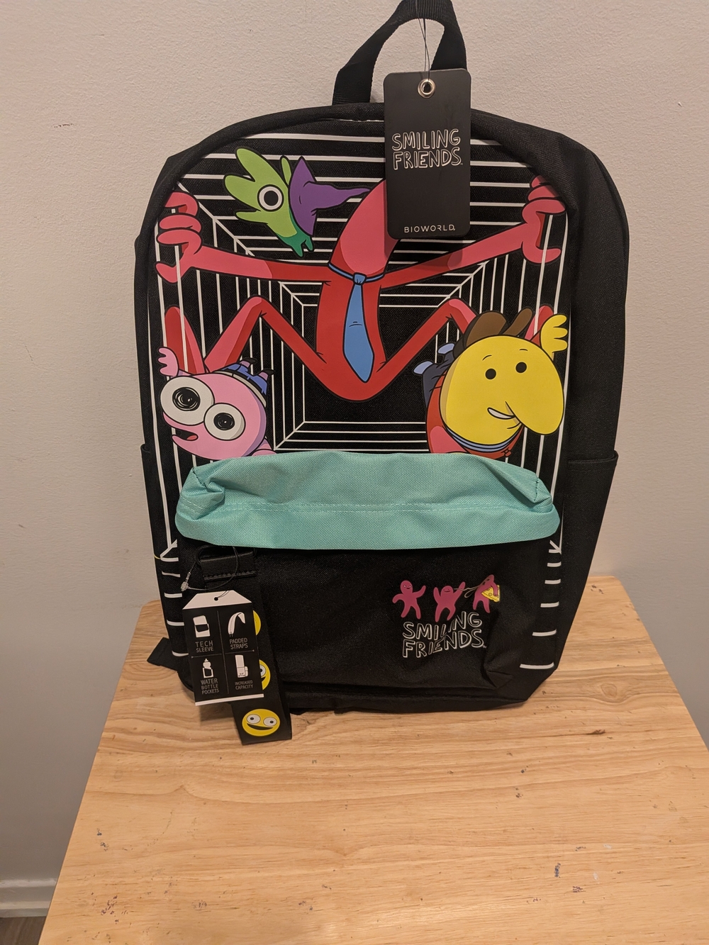 Bioworld Kids Black Backpack with Mint Front Pocket and Colorful Character Print